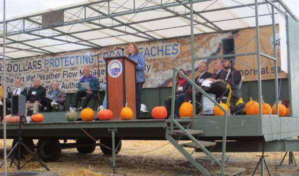 Public outreach for engineered projects – Engineer explaining design during ribbon-cutting ceremony.
